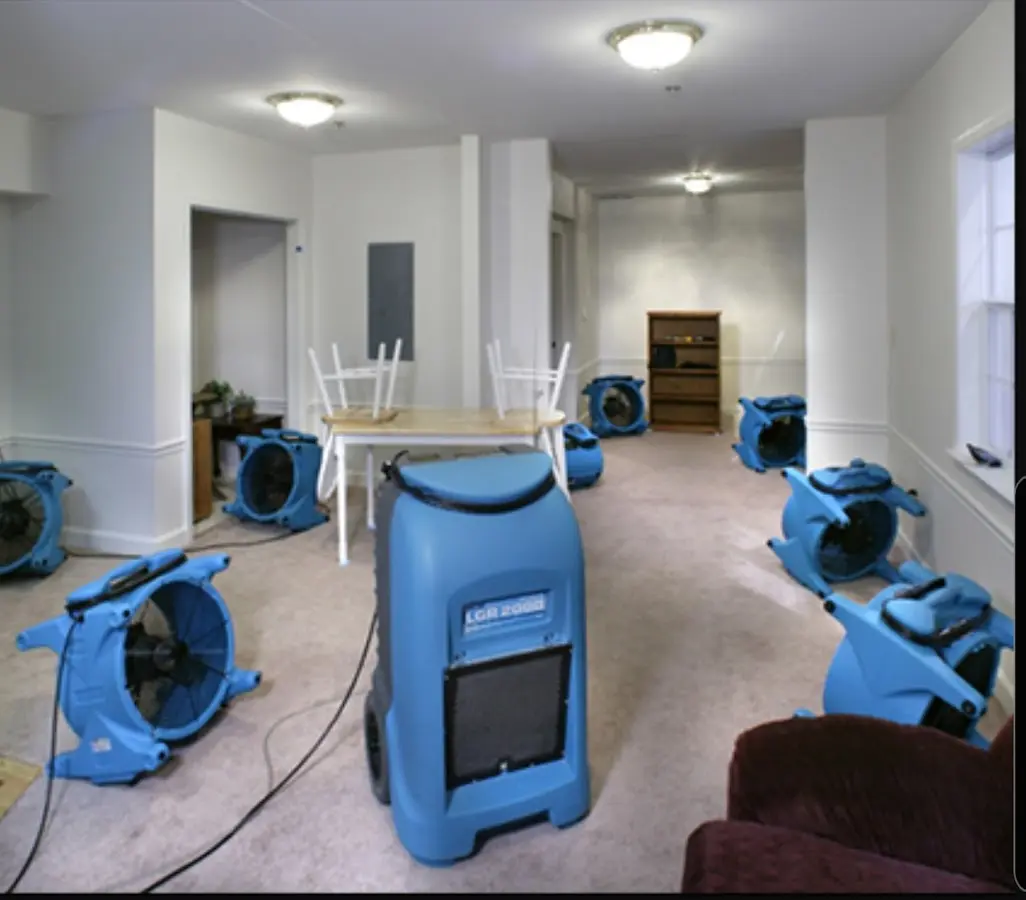Air movers and dehumidifier setup for Water Damage Restoration in Roxbury